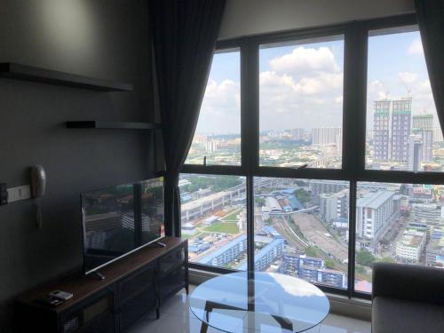 a room with a large window with a view of a city at Lucky Continew Residence 1 Bedroom - TRX KL in Kuala Lumpur