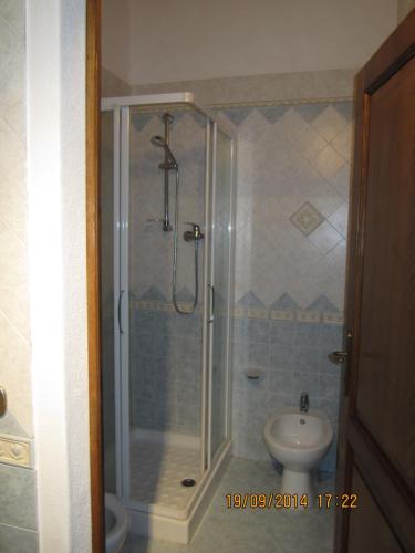 a bathroom with a shower and a sink at La Civetta in Torrita di Siena