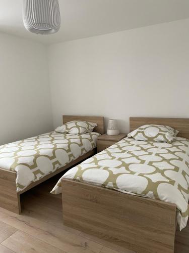 Katil atau katil-katil dalam bilik di appartement le fil d'or