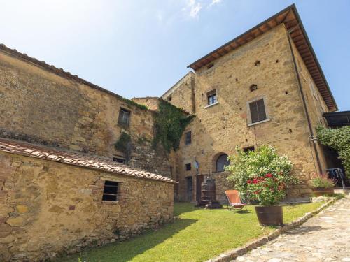 a large stone building with a yard in front of it at Apartment Le Buche-4 by Interhome in Monsanto