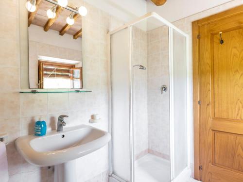 a bathroom with a sink and a shower at Apartment Ciliegio by Interhome in Monsanto