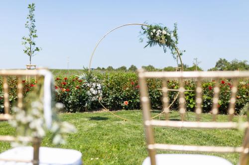 an image of an outdoor wedding ceremony with flowers at Vinařský Penzion in Strachotice