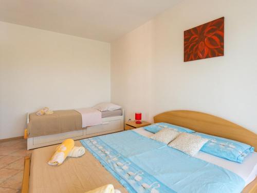 Ένα ή περισσότερα κρεβάτια σε δωμάτιο στο Apartment Giuliano-4 by Interhome