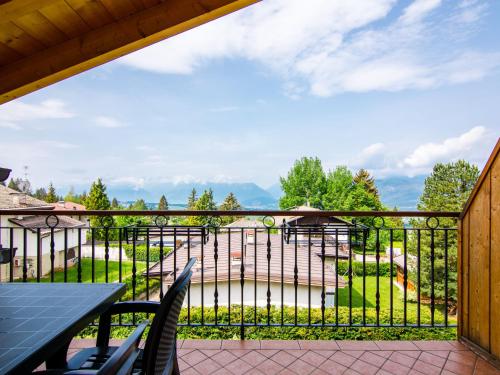 a balcony with a view of a garden at Apartment Pensione Villa Belfiore-2 by Interhome in Ronzone