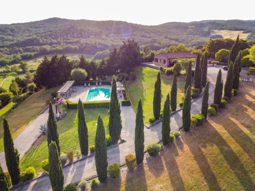 an aerial view of a villa with a pool and trees at Holiday Home Girasole-2 by Interhome in Montecatini Val di Cecina