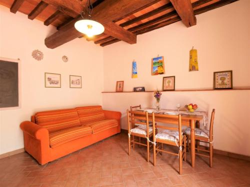 a living room with a couch and a table at Apartment Pian dei Carpini - Laura by Interhome in Prata
