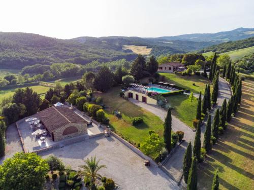 an aerial view of a mansion with a pool and trees at Apartment Girasole-3 by Interhome in Montecatini Val di Cecina