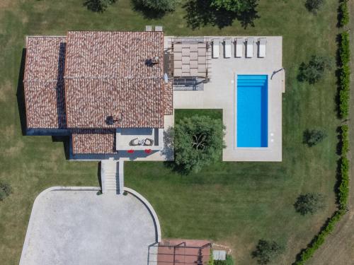 an aerial view of a house with a pool at Villa Blog 1 by Interhome in Vošteni