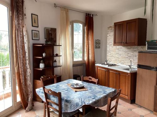 a kitchen with a table with a blue table cloth at Apartment Rotondo by Interhome in Santa Domenica