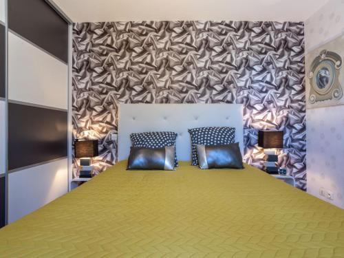 Katil atau katil-katil dalam bilik di Holiday Home La Gare by Interhome