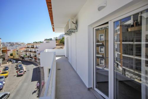 a balcony of a building with a view of a city at Sun Lovers Hostel in Albufeira