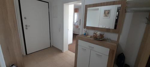 a bathroom with a sink and a mirror at Apartment Sunrise, Polje - otok Krk in Polje