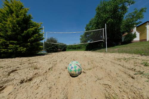 a soccer ball in the sand in front of a goal at Panoráma Nyaraló in Szentbékkálla