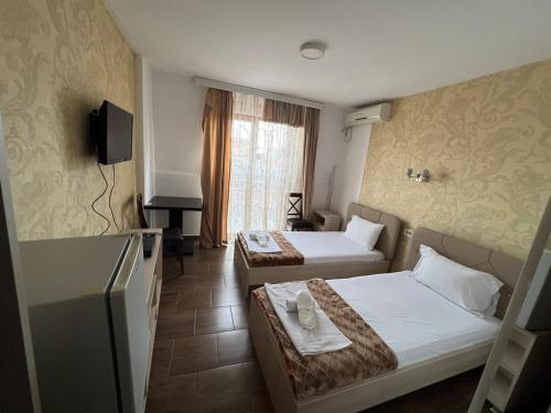 Postel nebo postele na pokoji v ubytování Hotel Ultra Star