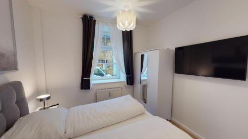 Postel nebo postele na pokoji v ubytování Lieblingsapartment No.2 in Top Citylage mit 1 SZ