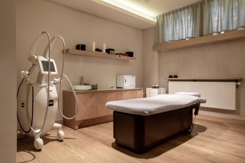 a hospital room with a bed and a machine at Aries Hotel & SPA Zakopane in Zakopane