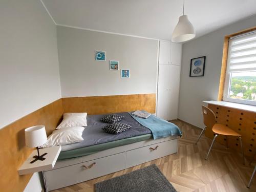 En eller flere senge i et værelse på Apartament Sopot Oliwia III