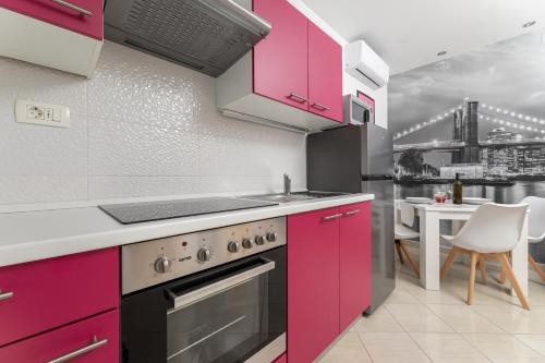 Kuchyň nebo kuchyňský kout v ubytování Apartments Jana