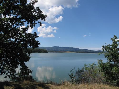a view of a lake with clouds in the sky at Holiday Home Dehtáře by Interhome in Hluboká nad Vltavou