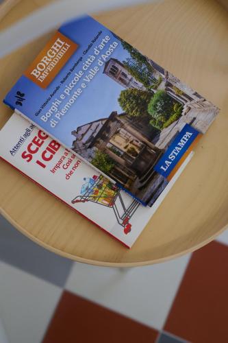 a book sitting on top of a table at Villa Marengo Guest House in Spinetta Marengo