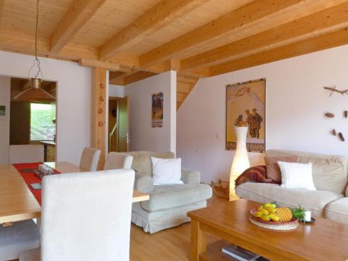 a living room with two couches and a table at Apartment Racer's Retreat Apt-2 by Interhome in Wengen