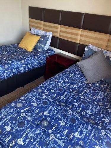 Postel nebo postele na pokoji v ubytování SapzRes at Taung