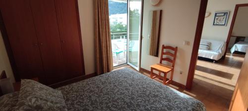 Кровать или кровати в номере Apartamento en Estartit