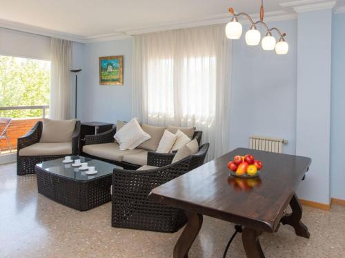 a living room with a couch and a table at Apartment Brumar by Interhome in Tossa de Mar