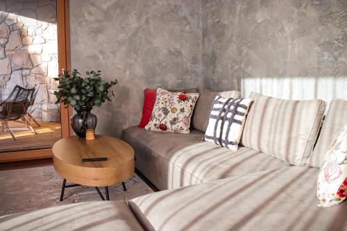 a living room with a couch and a table at Apartmany Furkotka - Ovruč in Vysoke Tatry - Strbske Pleso
