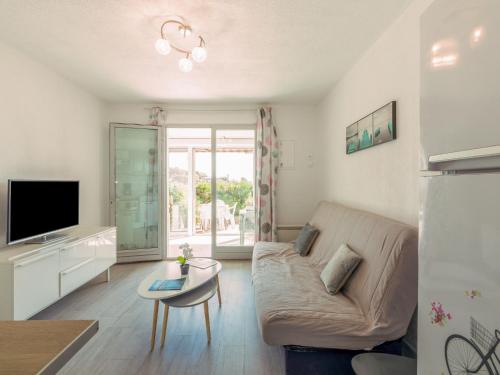 Televízia a/alebo spoločenská miestnosť v ubytovaní Apartment Le Front de Mer-4 by Interhome