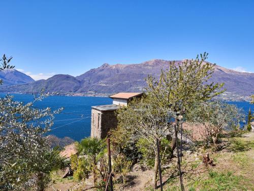 a building on the side of a hill overlooking a lake at Apartment Dado by Interhome in Bellano