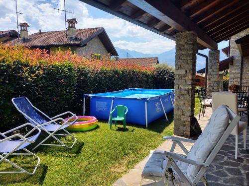 a group of chairs and a pool table in a yard at Holiday Home Mina by Interhome in Carriola