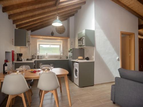 a kitchen and dining room with a table and chairs at Villa Sintra-Riviera by Interhome in Sintra