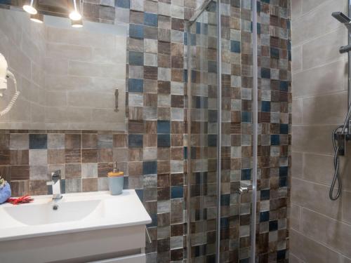 a bathroom with a sink and a mirror at Villa Sintra-Riviera by Interhome in Sintra