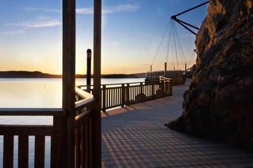 a dock with a view of a body of water at Bohusgården Hotell & Konferens in Uddevalla