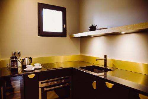 a small kitchen with a sink and a window at Villa Amara in Aix-en-Provence