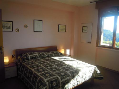En eller flere senge i et værelse på Holiday home Bel Panorama