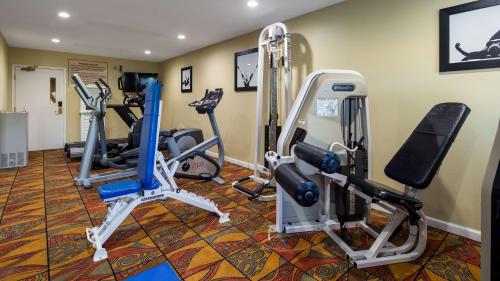 a gym with several tread machines in a room at Best Western Plus Newport News in Newport News