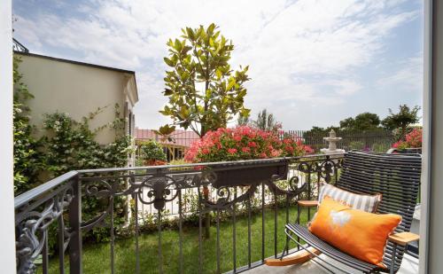 a balcony with two chairs and a fence at Mula Hotel in Istanbul