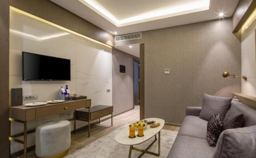 a living room with a couch and a table at Mula Hotel in Istanbul
