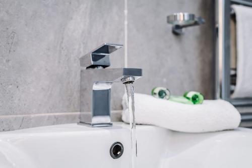 a bathroom sink with a water faucet at Host & Stay - The Georgian Quarters at Canning in Liverpool