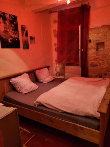 Postel nebo postele na pokoji v ubytování Gîtes chez Daniel "Languedoc"