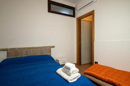 Ένα ή περισσότερα κρεβάτια σε δωμάτιο στο La Dimora degli Artisti