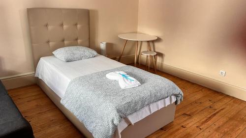 Łóżko lub łóżka w pokoju w obiekcie Hostel Brazuca