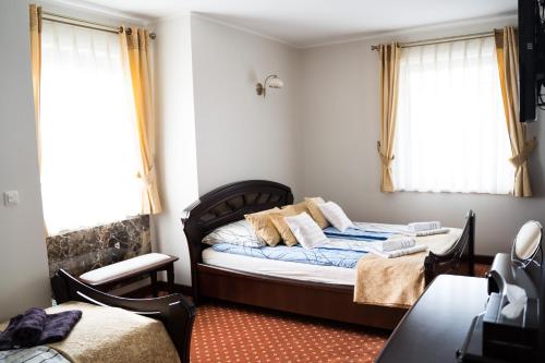 Кровать или кровати в номере Apartament z widokiem na morze