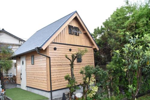 a small wooden building with a pitched roof at Guest House Fukuchan - Vacation STAY 83847v in Kaiyo