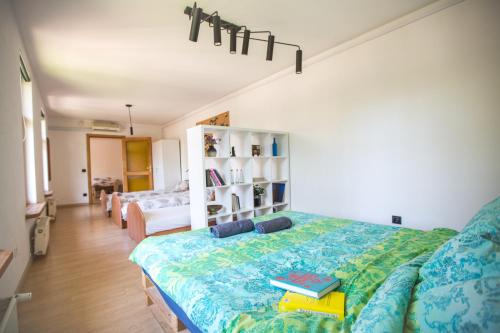 a bedroom with a bed with books on it at Wooden House near City center in Rīga
