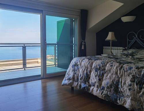 a bedroom with a bed and a view of the ocean at Taormina Helas Apartment by Taormina Holidays in Taormina