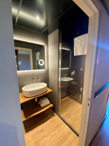 a bathroom with a sink and a mirror at Boutique Hotel, Restaurant & Wellness Westerburcht in Westerbork