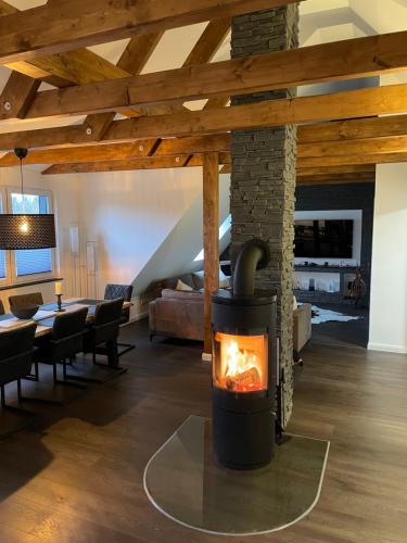 a fireplace in the living room of a house at Ferienwohnung Astrid in Alt Schwerin